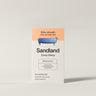 Box of Sandland Deep Sleep capsules on a light gray background