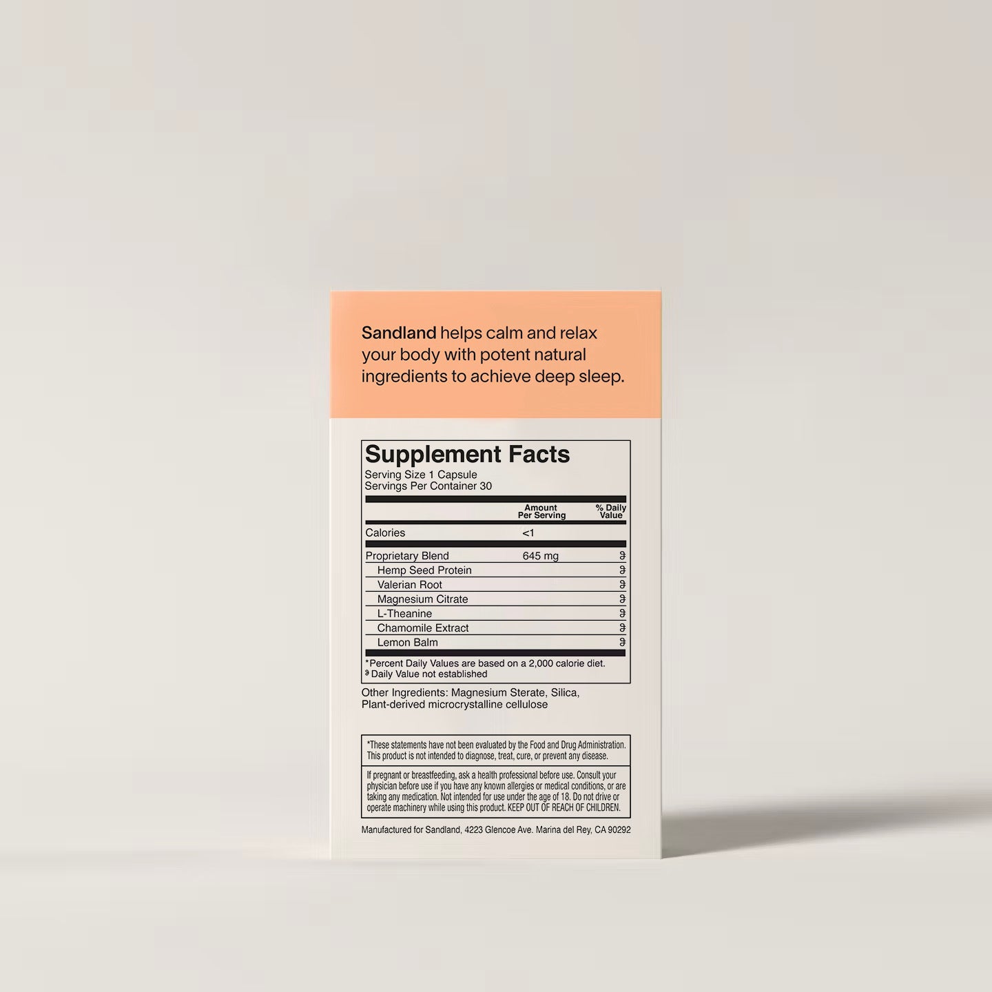 Supplement label with 'Sandland' branding on a light gray background