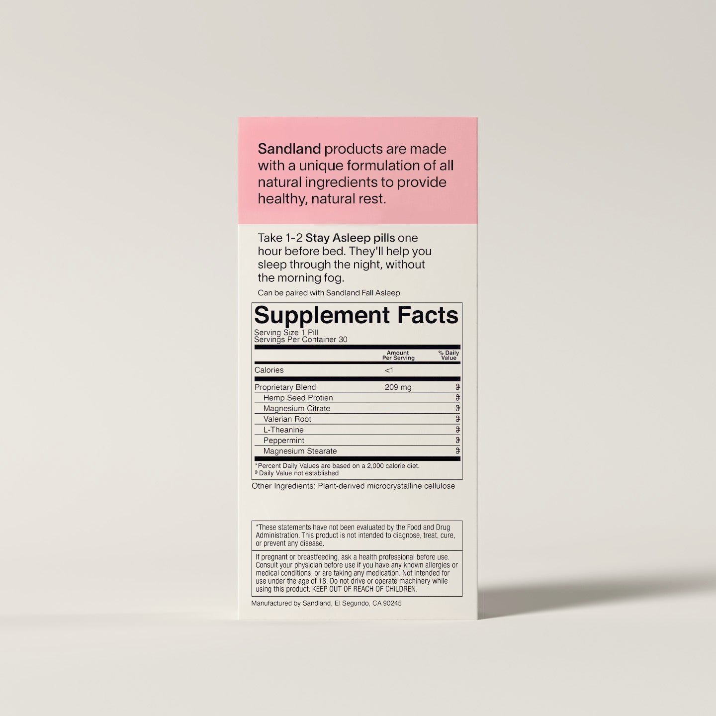 Supplement label with 'Sandland' branding on a beige background
