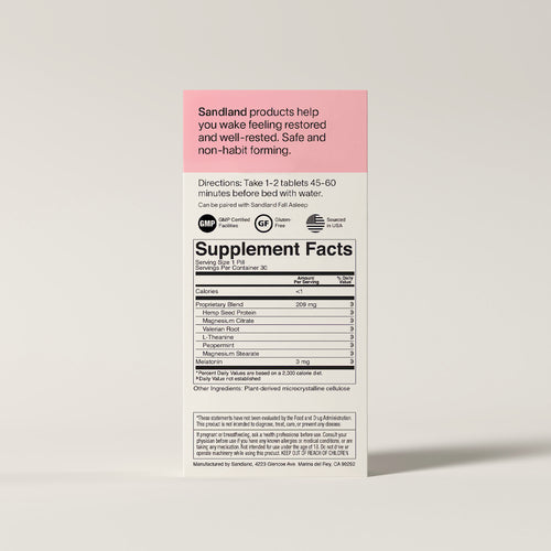 Supplement label with pink and black design on a beige background